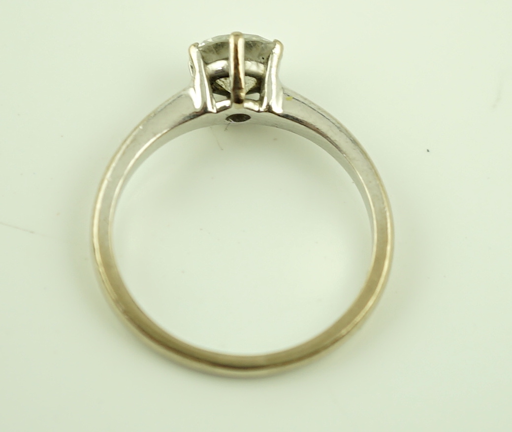 A modern 18ct white gold and solitaire diamond ring